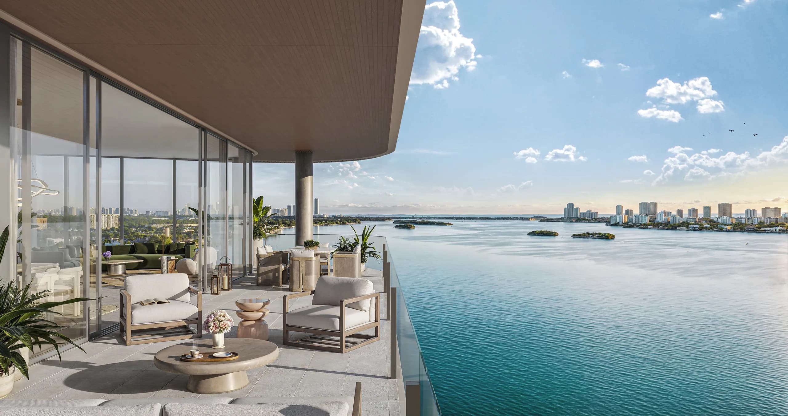 Curved-overhang terrace with bay-front seating overlooking Biscayne Bay