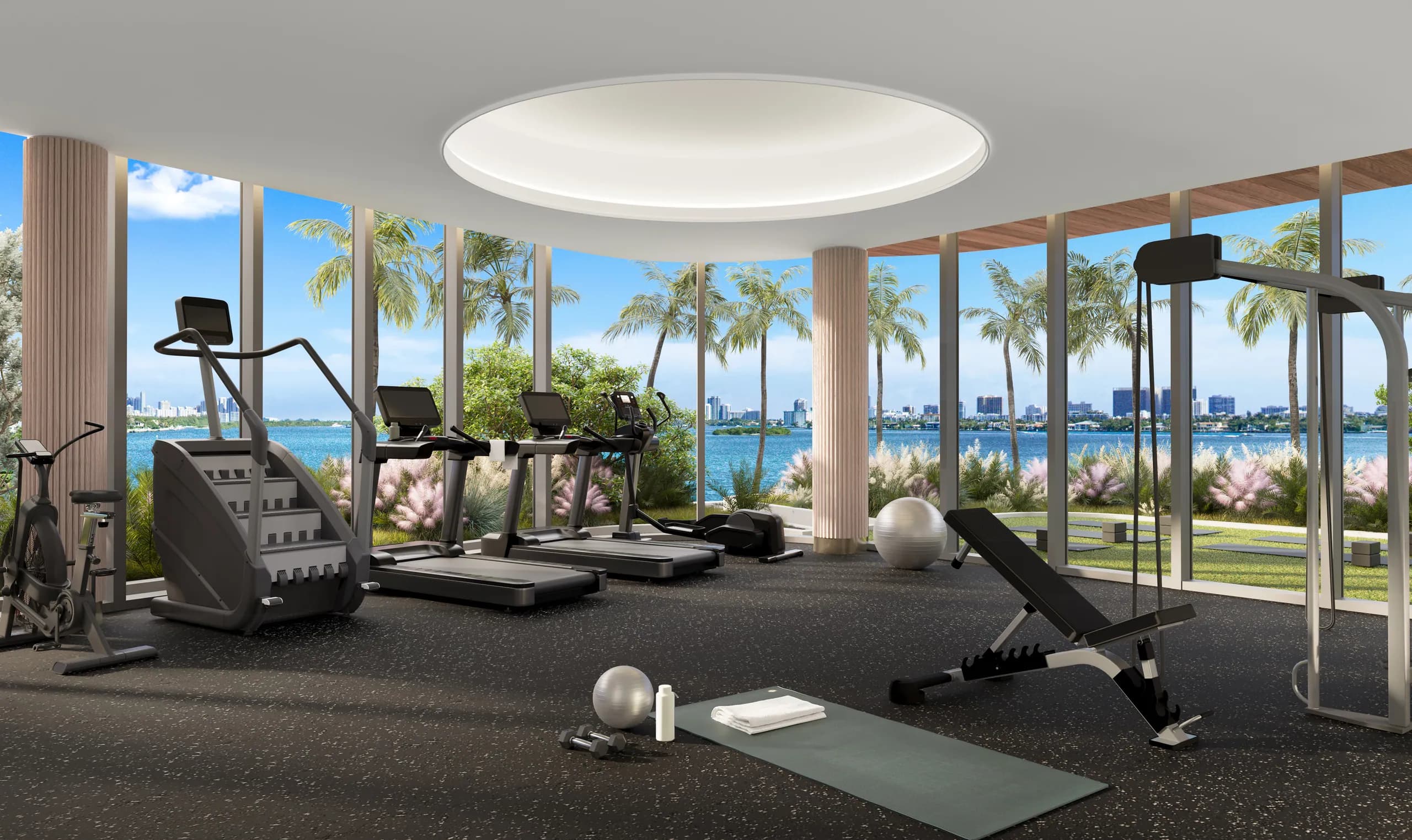Round-coffer fitness center with cardio gear and bay through wrap-around glass