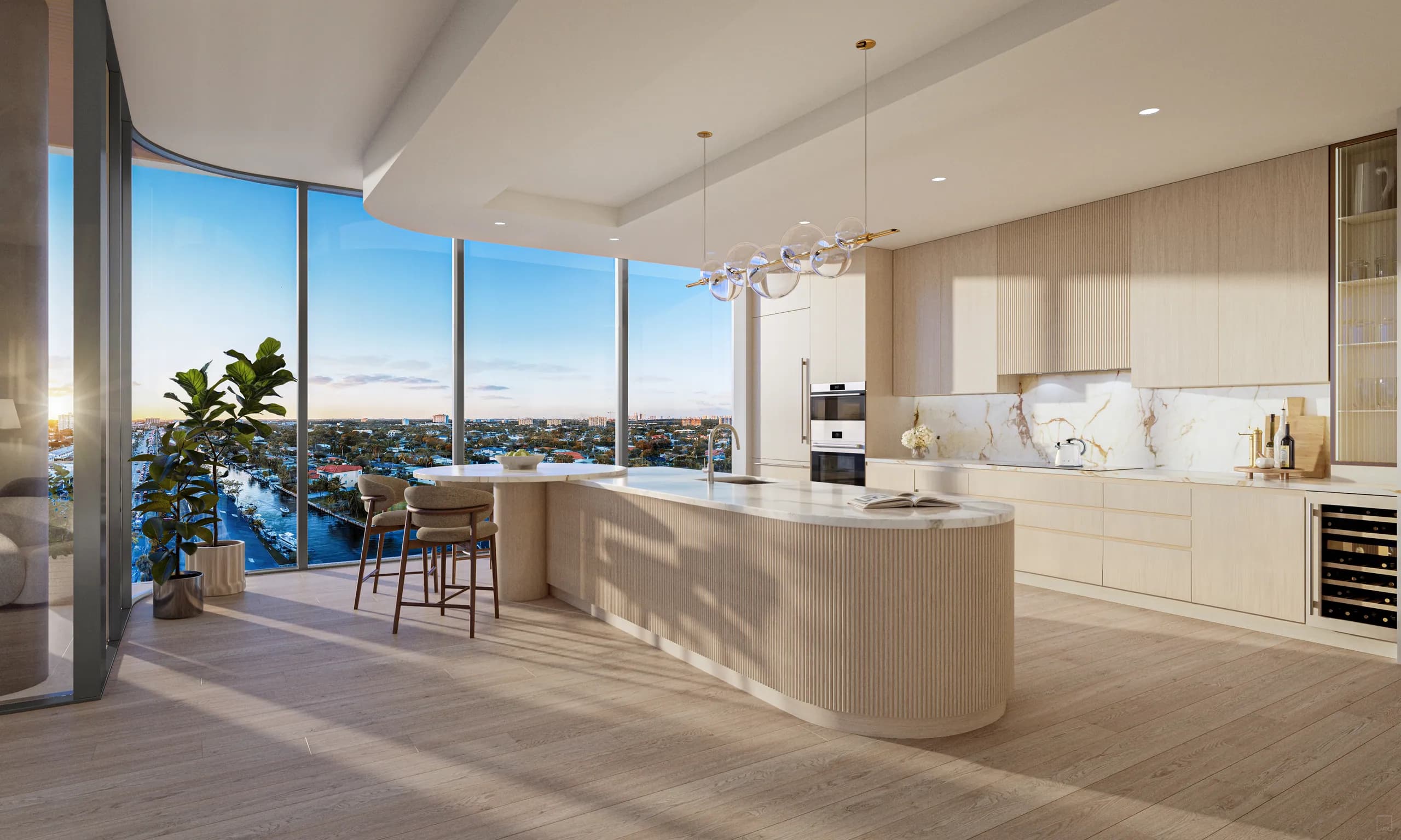 Curved-island kitchen with marble backsplash and bay view